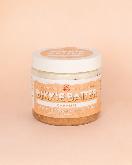 Jar of Bikkie Batter Caramel on a beige background